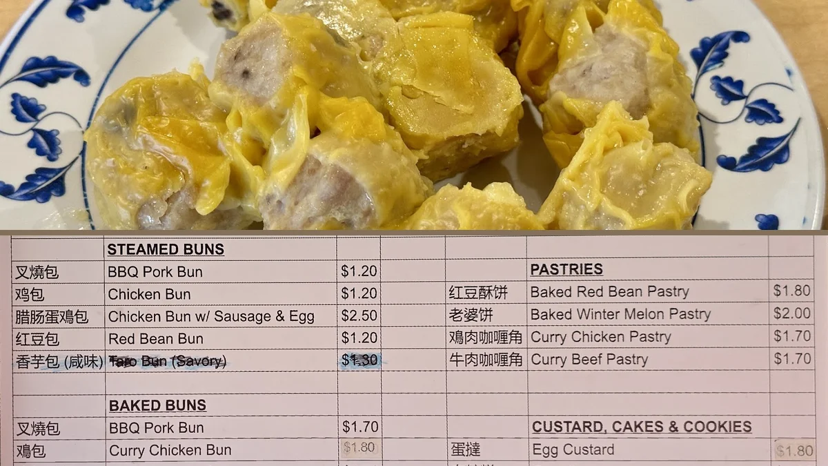Counter service with trays of hot food.